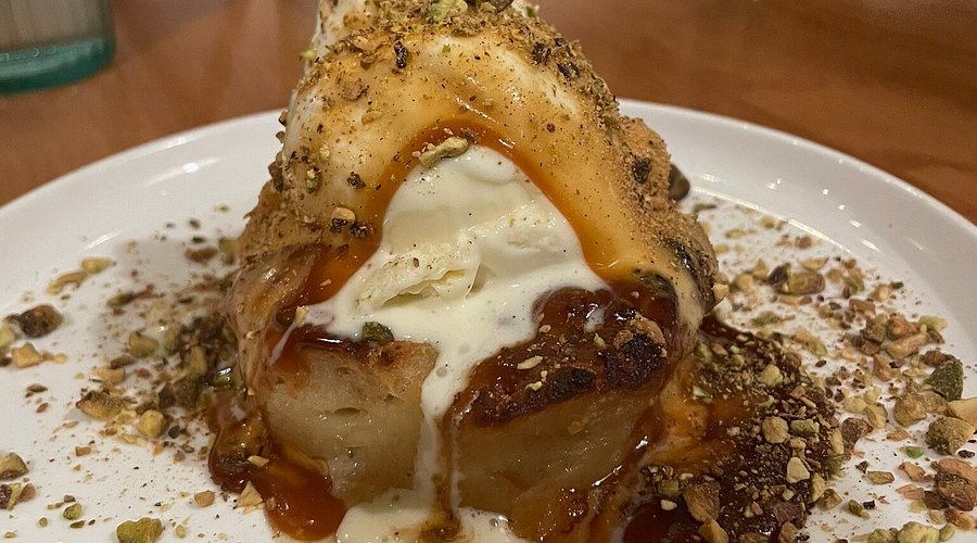 Sunday Gravy signature dishes  Bread Pudding, Spaghetti and Meatballs, Lobster Cheesy Garlic Bread.